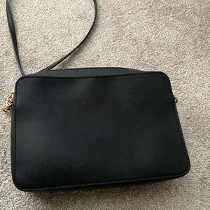 Michael Kors black cross body .. still has a lot of life left!